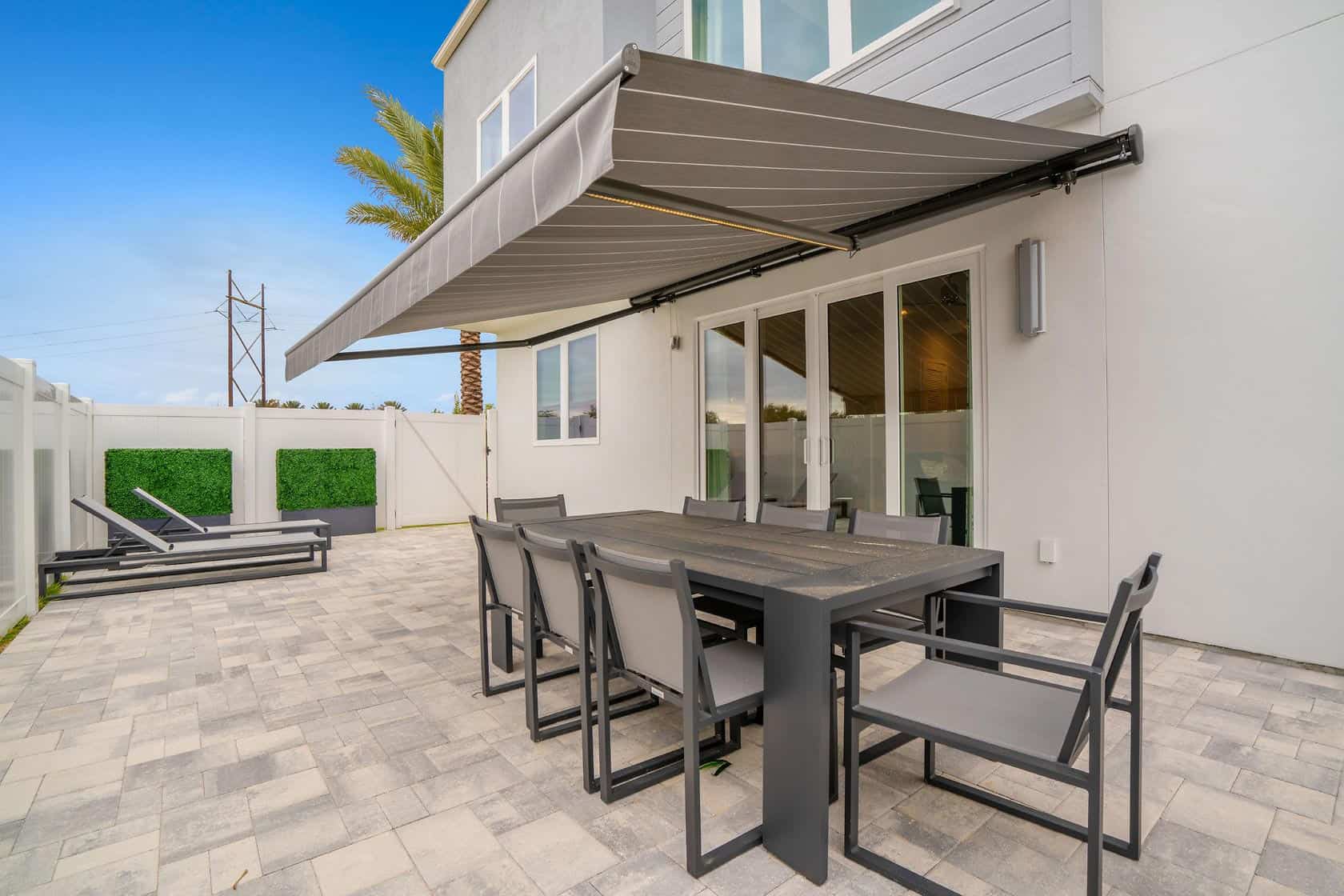 Home 12 Outdoor Patio With Covered Dining Table At A Spectrum Resort Orlando Residence.