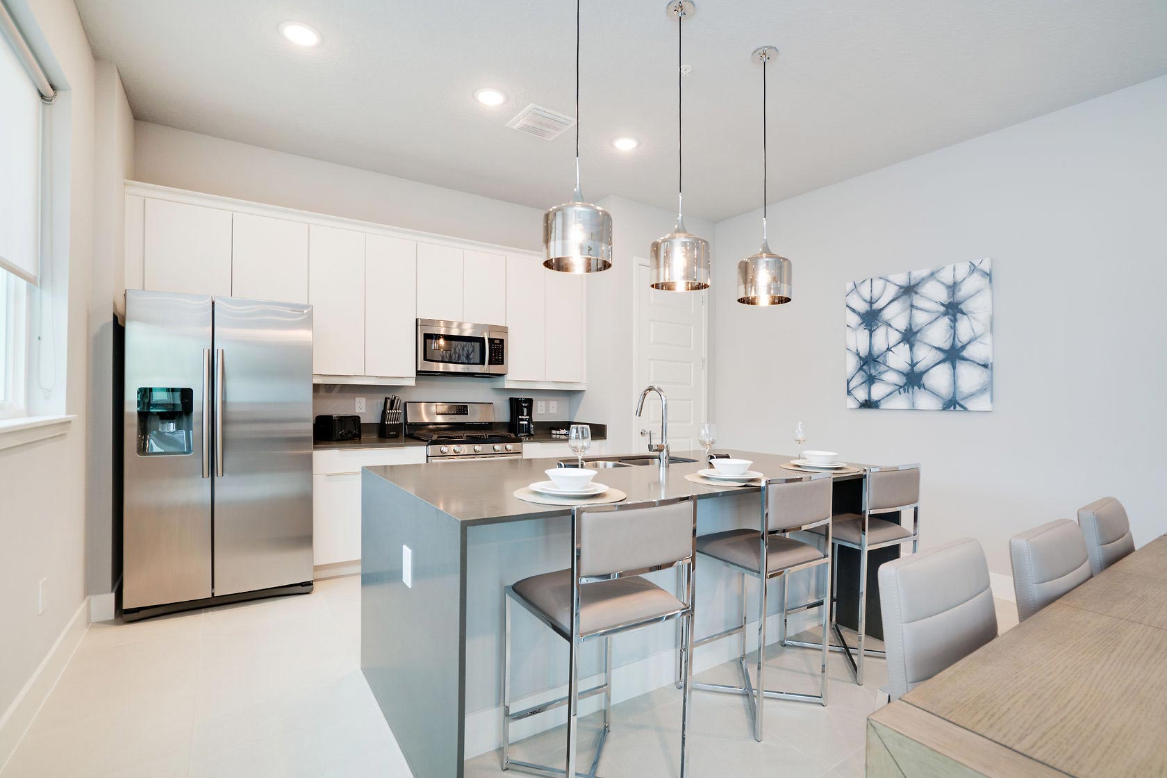 Home 18 Kitchen With Island Sink And Barstool Seating In A Spectrum Resort Orlando Vacation Home Rental.